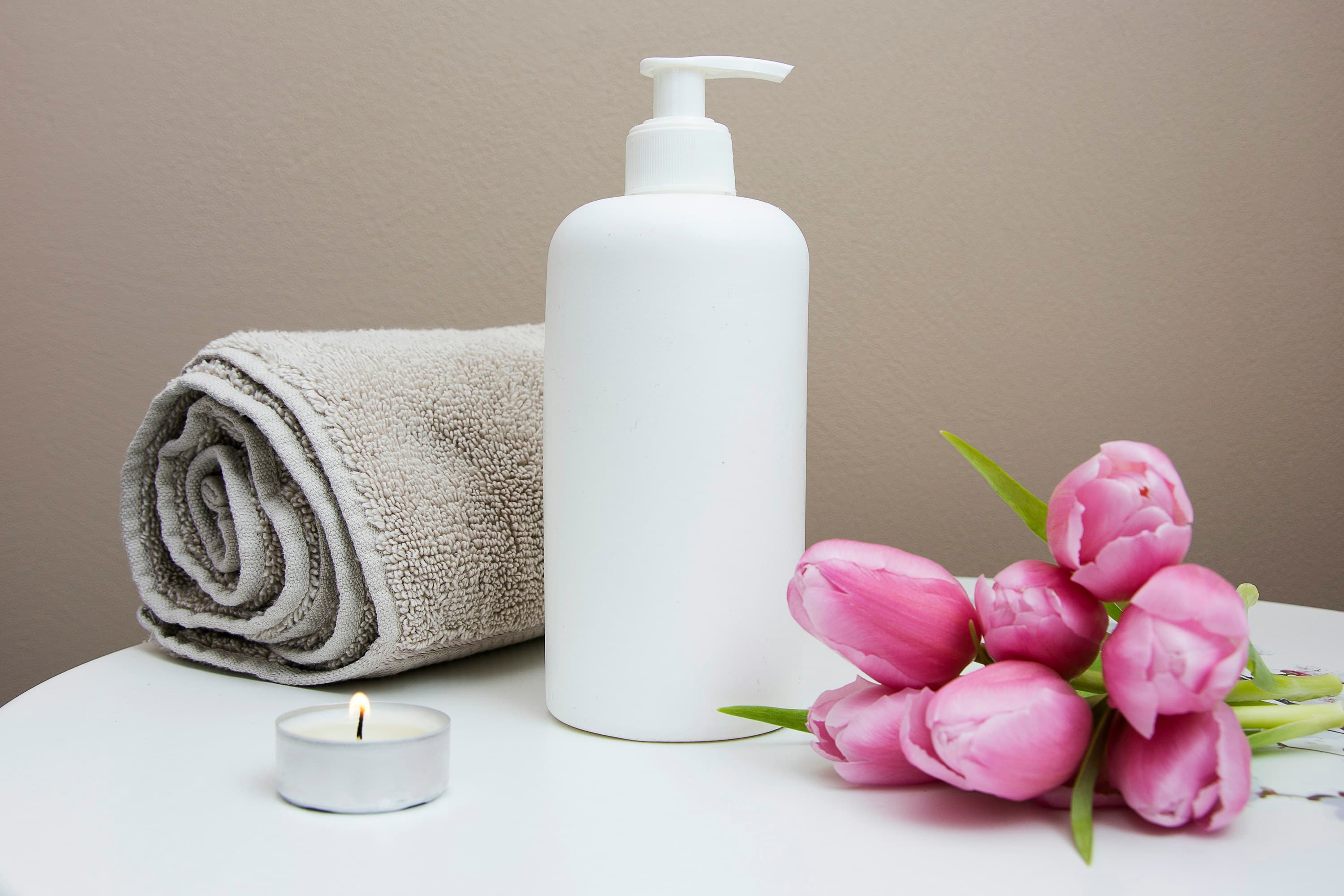 Serene, minimalist flotation therapy room with calm water and soft ambient glow