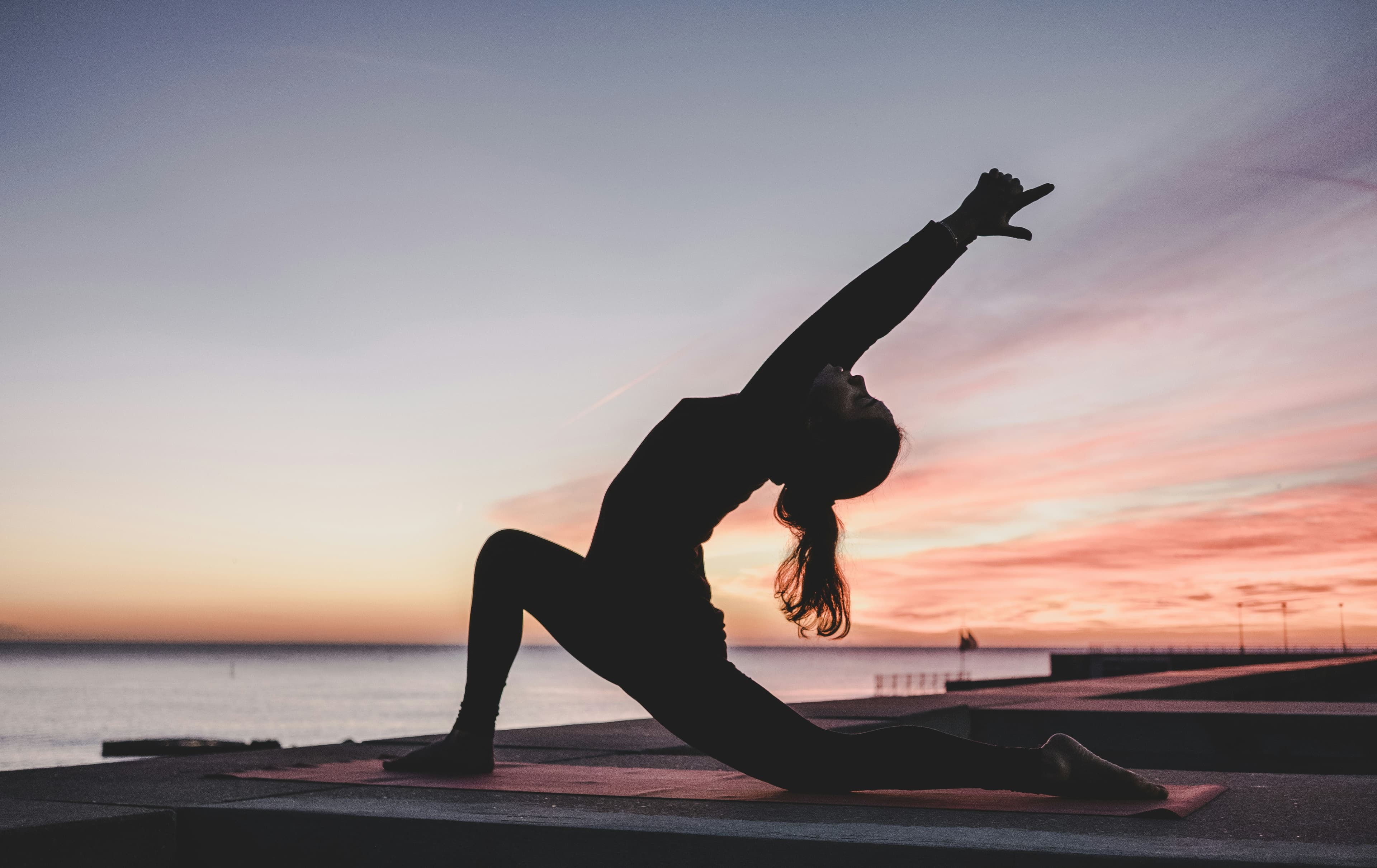 Mindful wellness founder meditating in a serene sunlit space