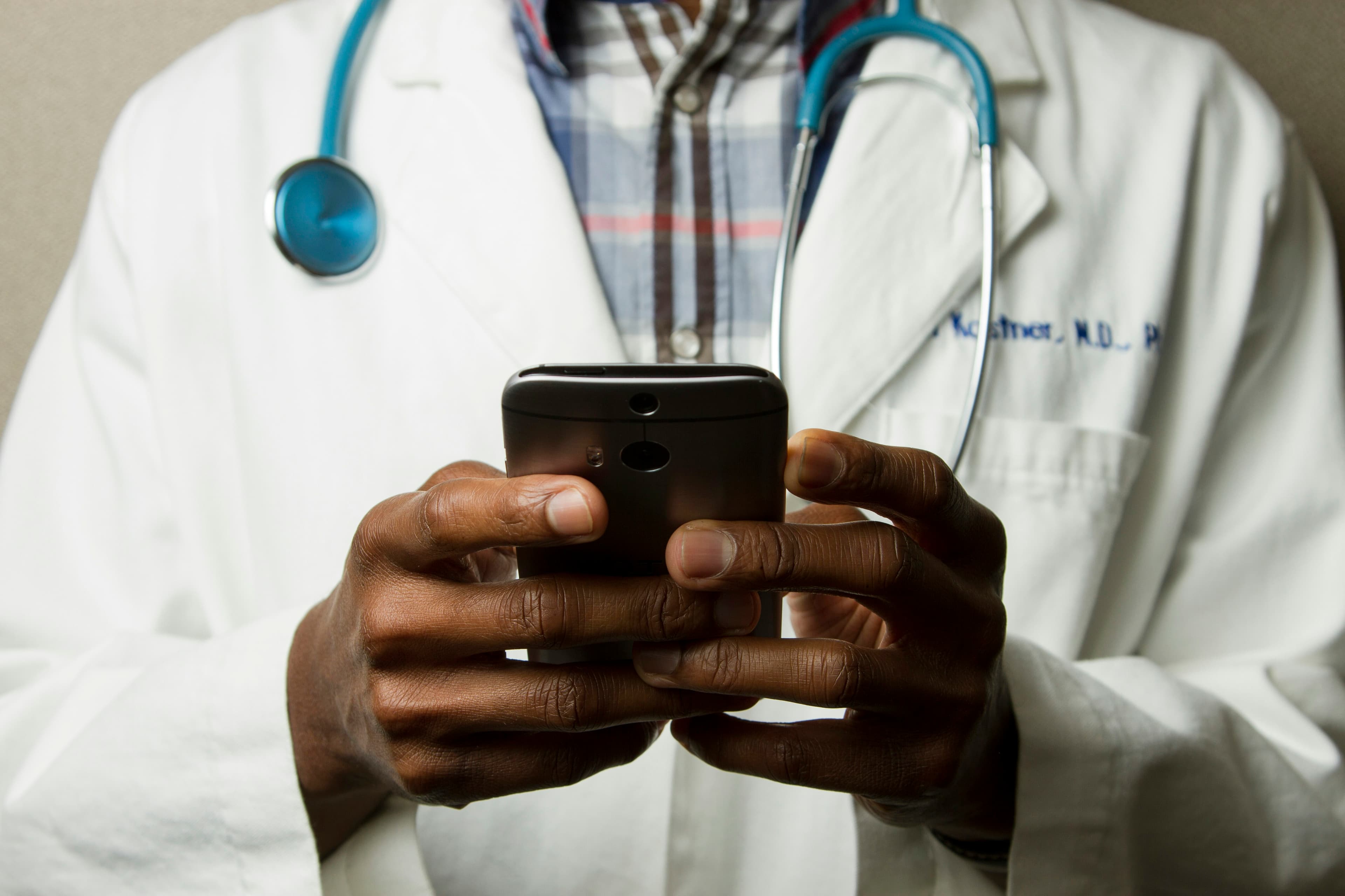 Integrative healthcare practitioner examining patient diagnostic chart on a digital screen